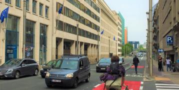Person biking on biking lane in Brussels