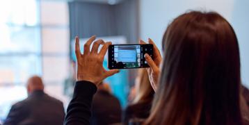 Person making photo during event Person making photo during event