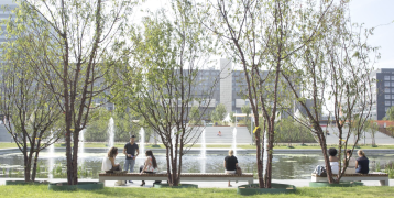 View of people sitting in front of a fountain