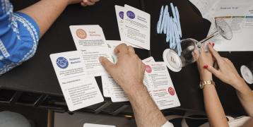 Make a wish survey a hand handling cards