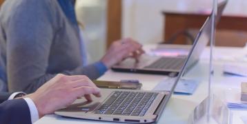 People typing on laptops People typing on laptops
