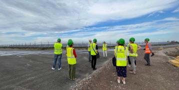 People visiting a gypsum landfill  redeveloped into a solar park